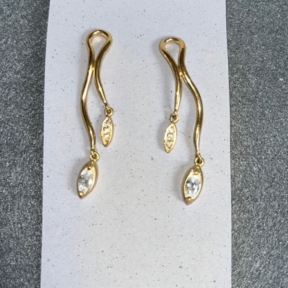Gold asymmetrical earrings with marquise rhinestones